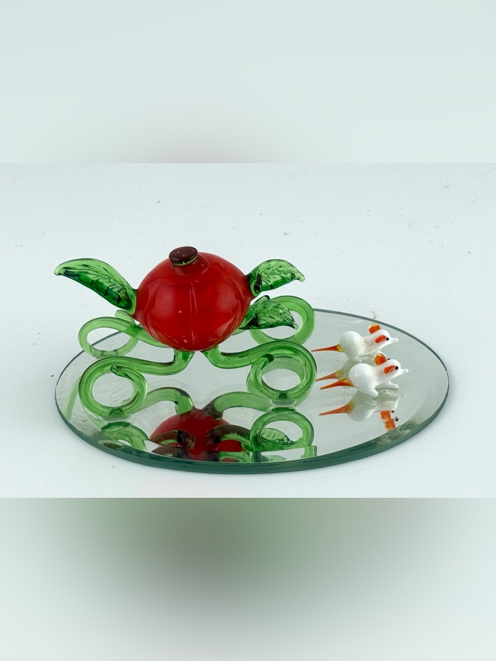 Hand-blown glass figurine display with mice